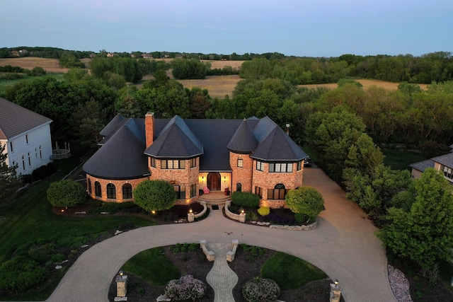 45 Silo Ridge Rd, Orland Park, IL 60467 - view of front of house featuring stone siding, curved driveway, and a chimney