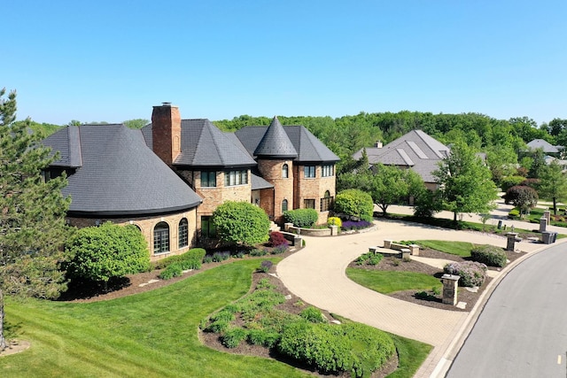 45 Silo Ridge Rd, Orland Park, IL 60467 - view of front of house featuring a chimney, brick siding, and a front lawn