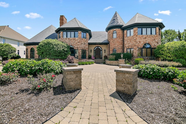 45 Silo Ridge Rd, Orland Park, IL 60467 - view of front of home with brick siding, a high end roof, and a chimney