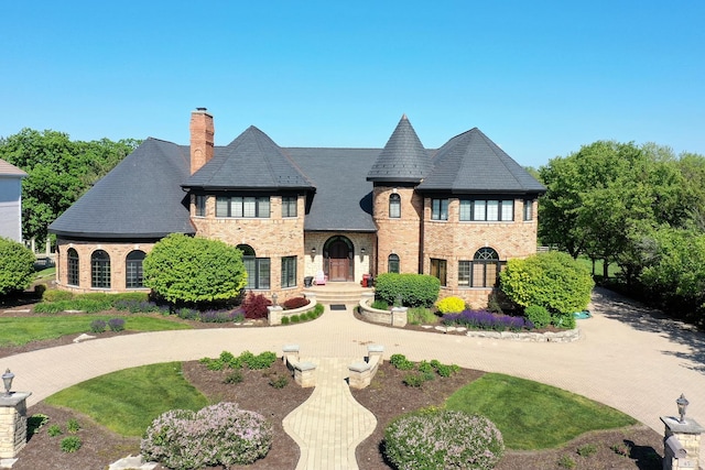 45 Silo Ridge Rd, Orland Park, IL 60467 - french country inspired facade featuring a chimney, brick siding, and a high end roof
