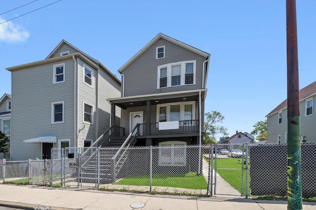 8543 S Burley Ave, Chicago, IL 60617 - view of front of home featuring a gate, covered porch, a fenced front yard, and stairway