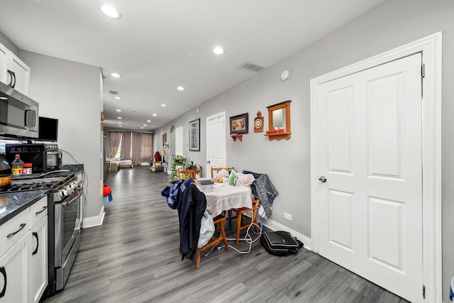 8543 S Burley Ave, Chicago, IL 60617 - dining room featuring recessed lighting, baseboards, and wood finished floors