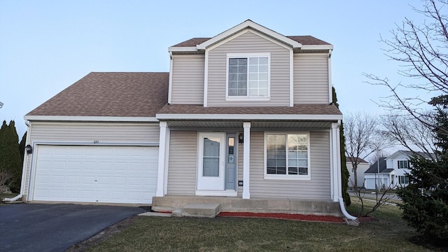 653 Fairview Ln, South Elgin, IL 60177 - traditional-style house featuring a porch, driveway, an attached garage, and a shingled roof