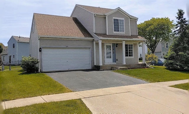 653 Fairview Ln, South Elgin, IL 60177 - traditional-style home featuring driveway, covered porch, an attached garage, and a front yard