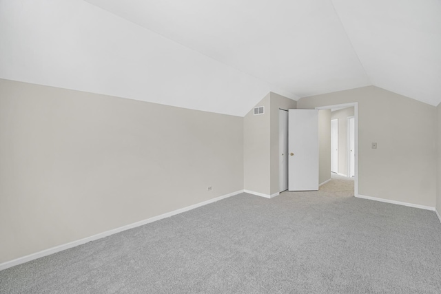 653 Fairview Ln, South Elgin, IL 60177 - additional living space with lofted ceiling, baseboards, and carpet floors