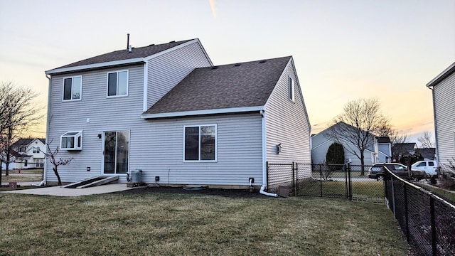 653 Fairview Ln, South Elgin, IL 60177 - back of house at dusk featuring a shingled roof and a gate
