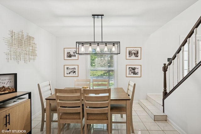 109 College Xing, Rolling Meadows, IL 60008 - dining room with light tile patterned flooring, stairway, a chandelier, and baseboards
