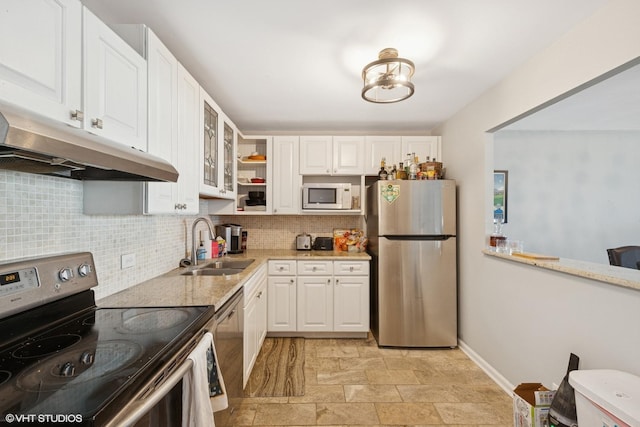 1636 N Wells St Unit 2601, Chicago, IL 60614 - kitchen with appliances with stainless steel finishes, a sink, backsplash, and white cabinets