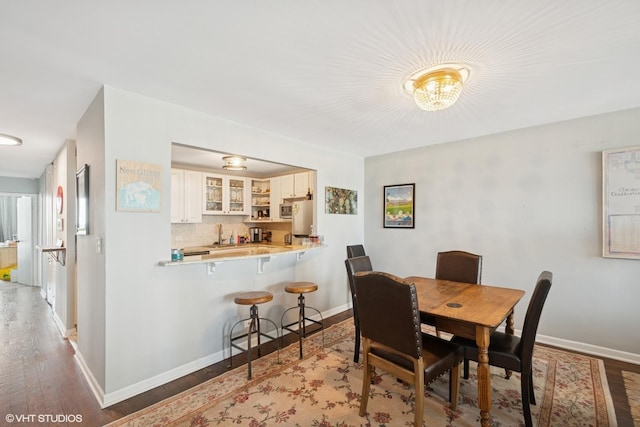 1636 N Wells St Unit 2601, Chicago, IL 60614 - dining space featuring wood finished floors and baseboards