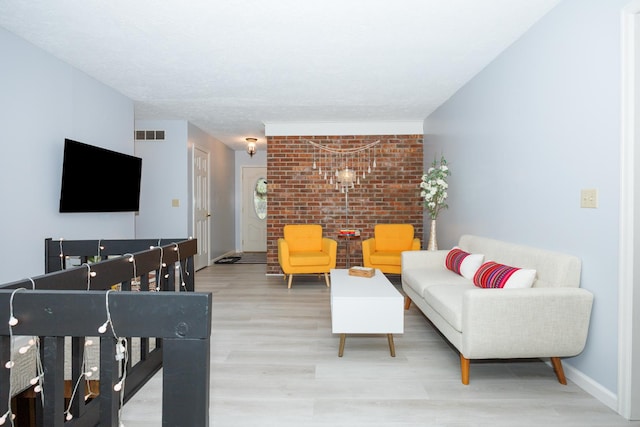 203 S Hershey Rd, Bloomington, IL 61704 - living room with wood finished floors, brick wall, and baseboards