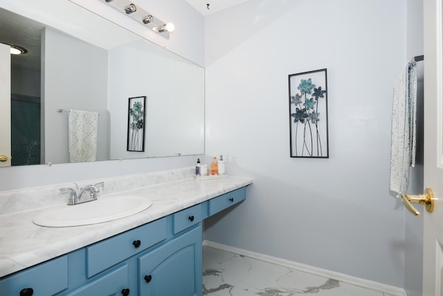 203 S Hershey Rd, Bloomington, IL 61704 - bathroom featuring marble finish floors, vanity, and baseboards