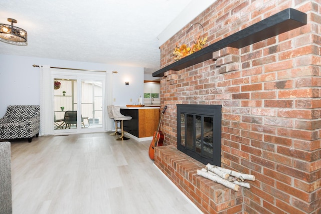 203 S Hershey Rd, Bloomington, IL 61704 - living room with wood finished floors and a fireplace