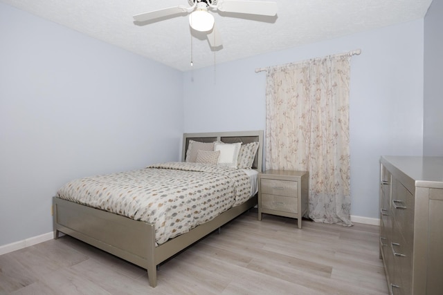 203 S Hershey Rd, Bloomington, IL 61704 - bedroom featuring light wood finished floors, baseboards, and a ceiling fan