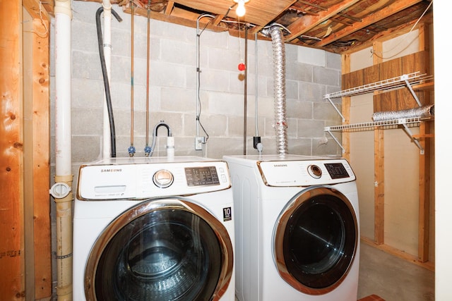 203 S Hershey Rd, Bloomington, IL 61704 - laundry area featuring separate washer and dryer and concrete block wall