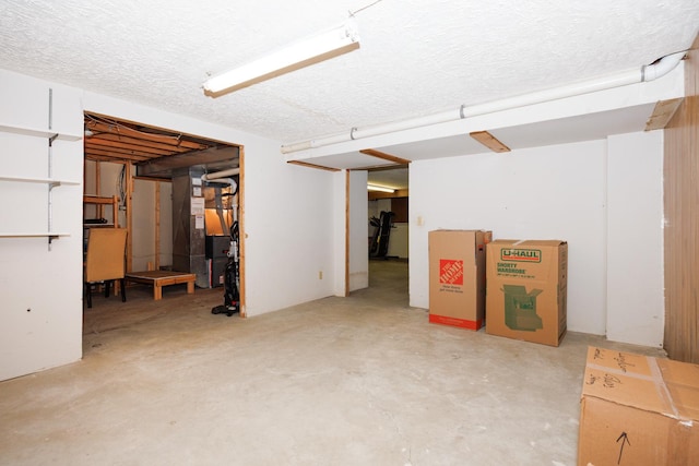 203 S Hershey Rd, Bloomington, IL 61704 - basement with heating unit and a textured ceiling