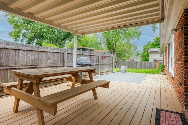 203 S Hershey Rd, Bloomington, IL 61704 - wooden deck featuring a fenced backyard and a patio area