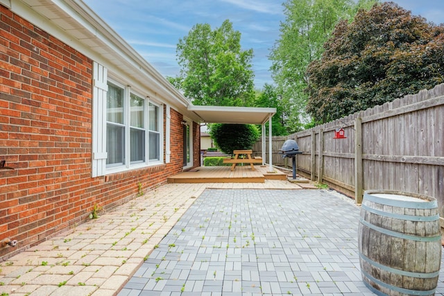 203 S Hershey Rd, Bloomington, IL 61704 - fenced backyard with a deck, a patio area, and grilling area