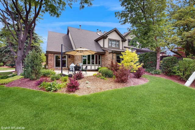 14352 Crystal Tree Dr, Orland Park, IL 60462 - rear view of property featuring a yard, brick siding, a patio area, and a chimney
