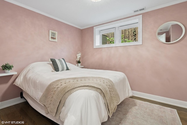 4428 N Racine Ave Unit Gn, Chicago, IL 60640 - bedroom featuring baseboards, wood finished floors, and crown molding