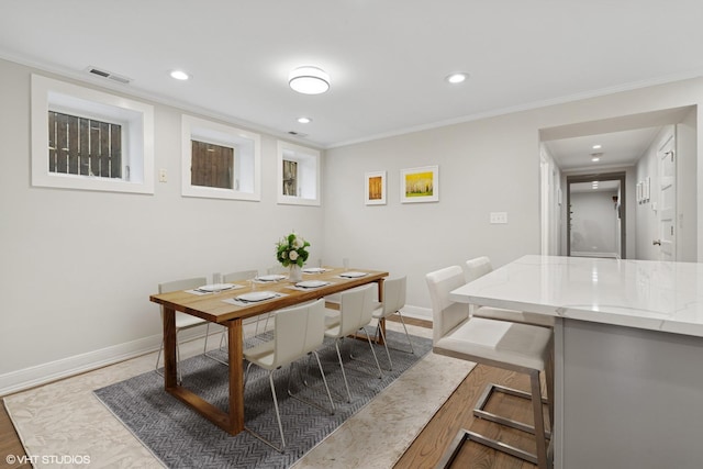 4428 N Racine Ave Unit Gn, Chicago, IL 60640 - dining area with baseboards, recessed lighting, and crown molding