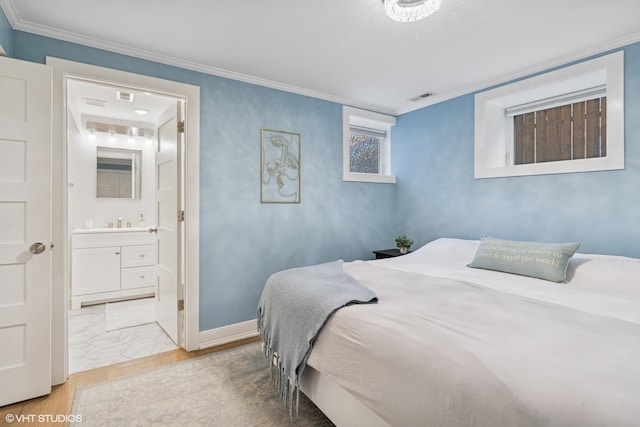 4428 N Racine Ave Unit Gn, Chicago, IL 60640 - bedroom with ornamental molding, baseboards, and connected bathroom