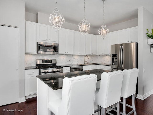 550 W Fulton St Unit 404, Chicago, IL 60661 - kitchen featuring appliances with stainless steel finishes, a chandelier, a sink, and dark wood finished floors