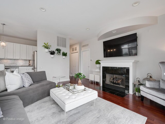 550 W Fulton St Unit 404, Chicago, IL 60661 - living room with wood finished floors, recessed lighting, and a tile fireplace