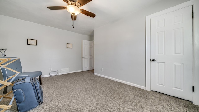 325 Goodrich St, Belvidere, IL 61008 - living area with carpet floors, ceiling fan, and baseboards