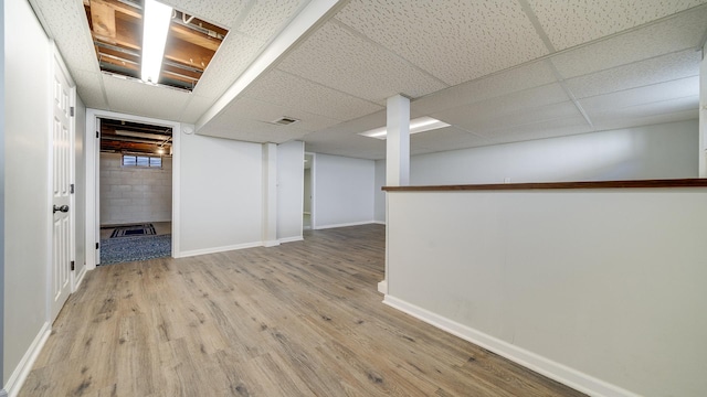 325 Goodrich St, Belvidere, IL 61008 - below grade area with wood finished floors and baseboards