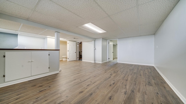 325 Goodrich St, Belvidere, IL 61008 - finished basement with wood finished floors, baseboards, and a drop ceiling