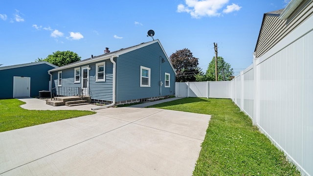 325 Goodrich St, Belvidere, IL 61008 - rear view of property featuring a patio and central AC