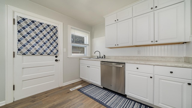325 Goodrich St, Belvidere, IL 61008 - kitchen with stainless steel dishwasher, a sink, dark wood-type flooring, and white cabinetry