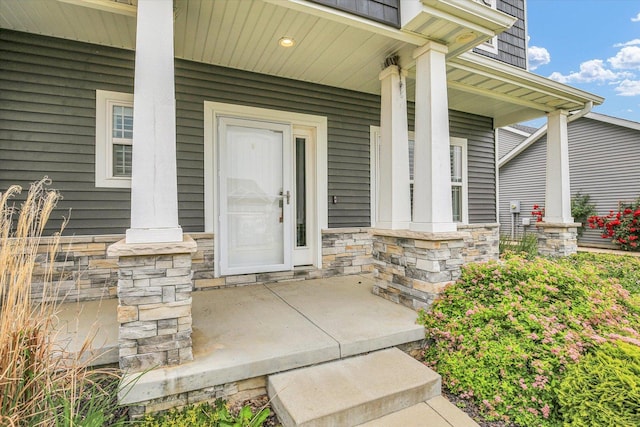 1407 Winterberry Rd, Savoy, IL 61874 - view of exterior entry featuring a porch and stone siding