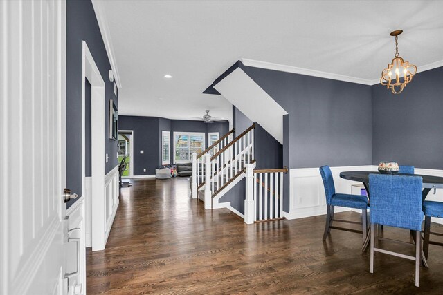 1407 Winterberry Rd, Savoy, IL 61874 - dining area featuring stairs, ornamental molding, a chandelier, wood finished floors, and recessed lighting