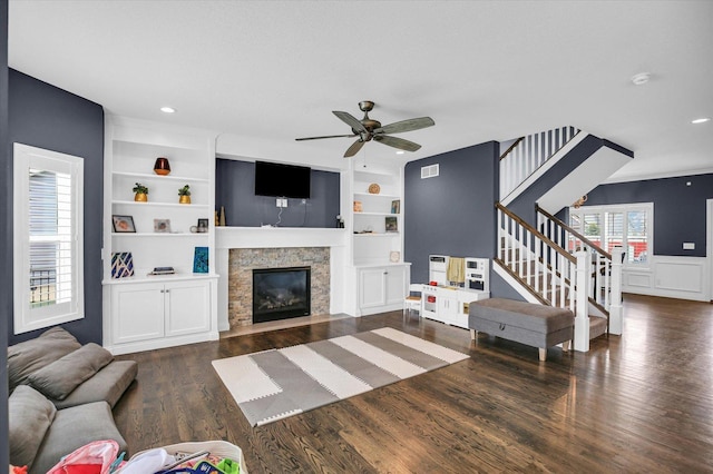 1407 Winterberry Rd, Savoy, IL 61874 - living room with ceiling fan, wood finished floors, a fireplace, built in shelves, and stairway