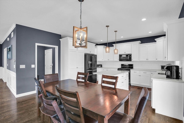 1407 Winterberry Rd, Savoy, IL 61874 - dining space featuring dark wood finished floors, a chandelier, and recessed lighting