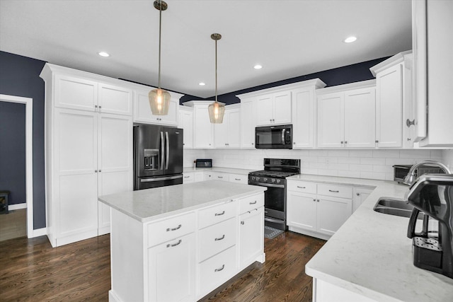 1407 Winterberry Rd, Savoy, IL 61874 - kitchen with refrigerator with ice dispenser, stainless steel range with gas cooktop, black microwave, a center island, and backsplash