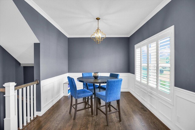 1407 Winterberry Rd, Savoy, IL 61874 - dining space featuring a chandelier, dark wood-style floors, a wainscoted wall, and ornamental molding