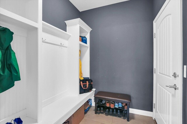1407 Winterberry Rd, Savoy, IL 61874 - mudroom with baseboards and tile patterned flooring