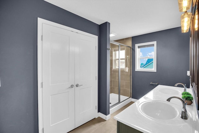 1407 Winterberry Rd, Savoy, IL 61874 - full bathroom featuring a shower stall, tile patterned floors, and double vanity