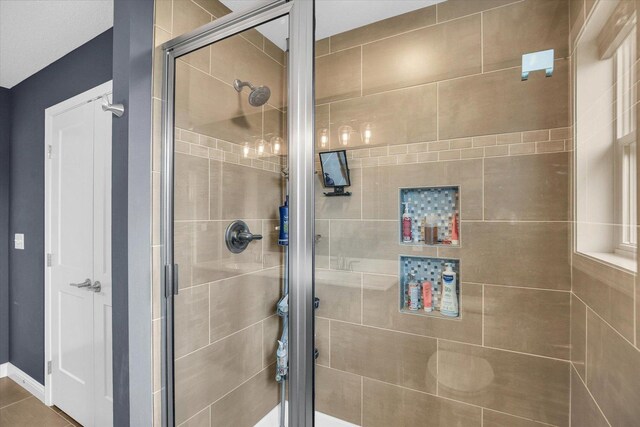 1407 Winterberry Rd, Savoy, IL 61874 - bathroom with a stall shower and baseboards