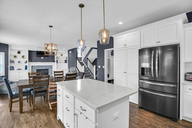 1407 Winterberry Rd, Savoy, IL 61874 - kitchen with fridge with ice dispenser, dark wood-style floors, open floor plan, a kitchen island, and recessed lighting