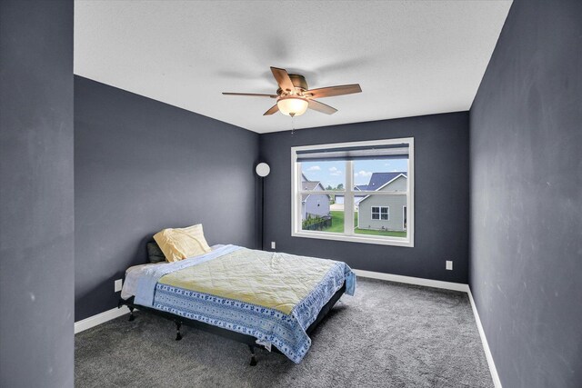 1407 Winterberry Rd, Savoy, IL 61874 - carpeted bedroom featuring baseboards and a ceiling fan