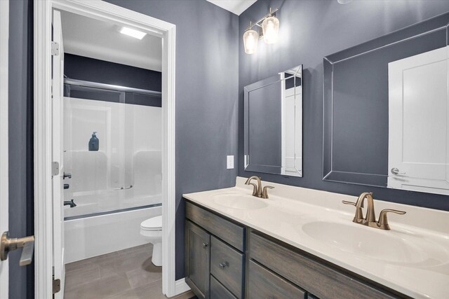 1407 Winterberry Rd, Savoy, IL 61874 - bathroom with double vanity and enclosed tub / shower combo