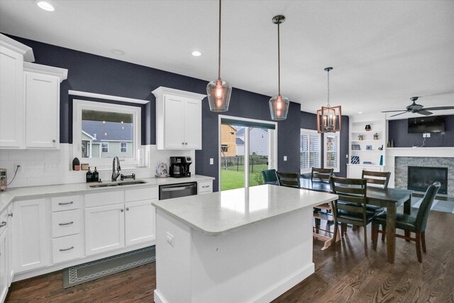 1407 Winterberry Rd, Savoy, IL 61874 - kitchen featuring ceiling fan, dark wood-style floors, open floor plan, white cabinetry, and a fireplace