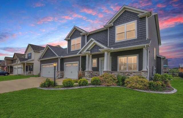 1407 Winterberry Rd, Savoy, IL 61874 - view of front of property featuring concrete driveway, stone siding, a porch, and a garage