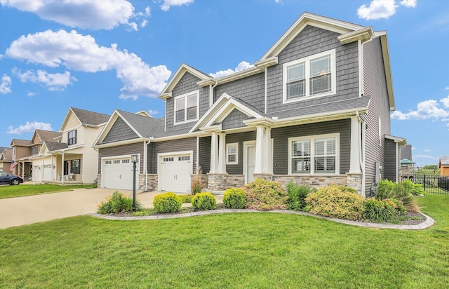 1407 Winterberry Rd, Savoy, IL 61874 - craftsman-style home with driveway, stone siding, a garage, and covered porch