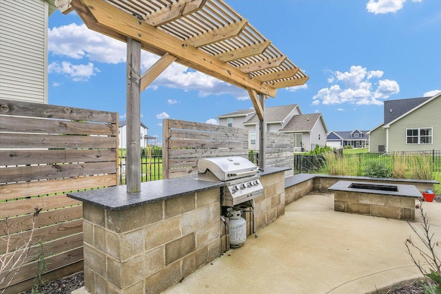 1407 Winterberry Rd, Savoy, IL 61874 - view of patio / terrace featuring area for grilling, an outdoor fire pit, a pergola, and a residential view