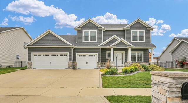 1407 Winterberry Rd, Savoy, IL 61874 - craftsman inspired home featuring driveway, stone siding, and covered porch