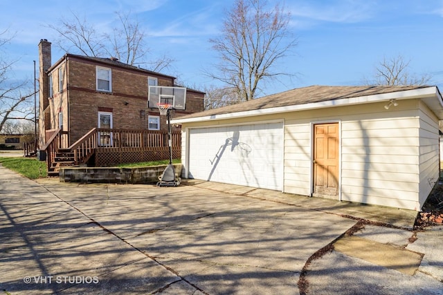 221 Cornwall Dr, Crete, IL 60417 - rear view of property featuring an outbuilding, a garage, a chimney, and a deck